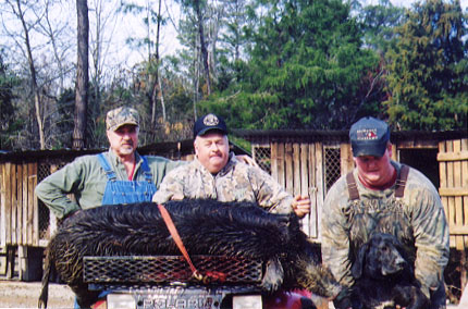Eugene Walker, Jay Dorsey, and Josh Whitesides with a 2001 hog