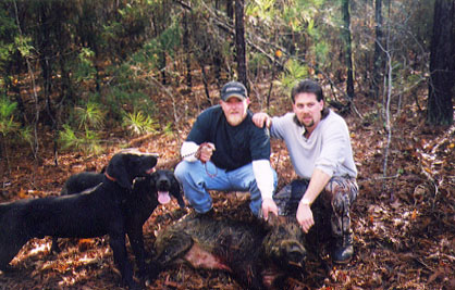 Chris Peck and Ronnie Fink with Redneck, Bearclaw, and a 2001 hog
